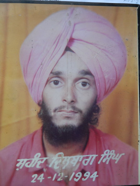 Photo of Dilbagh Singh, victim of extrajudicial execution on December 24, 1994Black cat