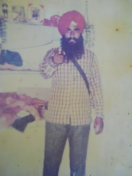 Photo of Mohinder Singh, victim of extrajudicial execution between October 1, 1991 and October 31,  1991, in Mitha, Kahnuwan, Gurdaspur,  by Punjab Police; Black cat, in Mitha, by Black cat